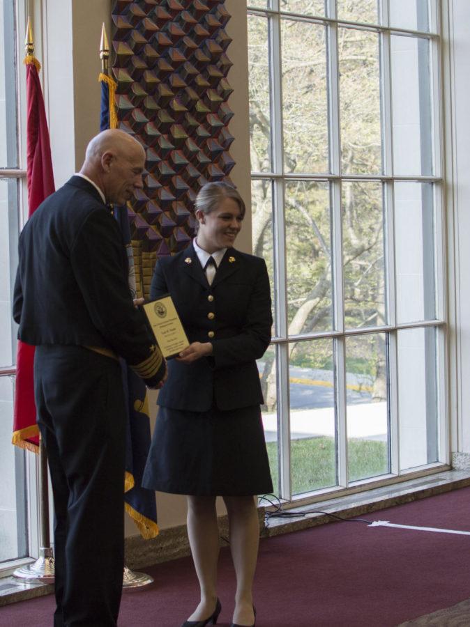 Leah Vander Boon, senior in communication studies, accepts an award during the Navy ROTC Awards Ceremony on April 11 in the Campanile Room of the Memorial Union.