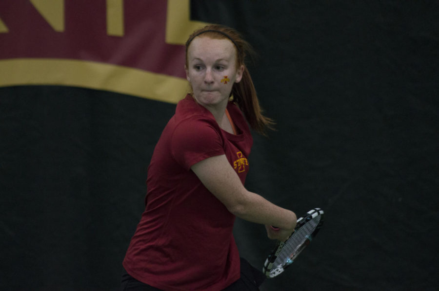 Senior Meghan Cassens returns the ball during the tennis match between Iowa State and Texas on March 27, which ended in a 4-2 loss for the Cyclones.