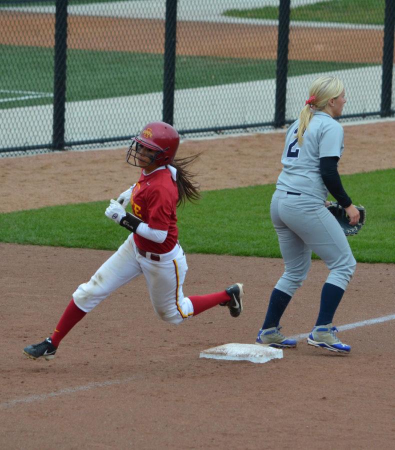 Junior Brittany Gomez rounds third heading for home, to score for Iowa State.