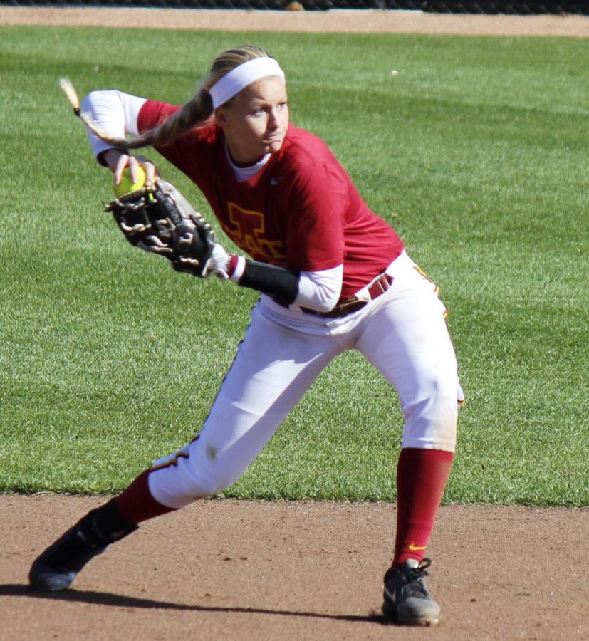 Senior infielder Lexi Slater catches and throws the ball to first base. Iowa State softball won both games against the Kirkwood Eagles on Oct. 18 at the Cyclone Sports Complex.