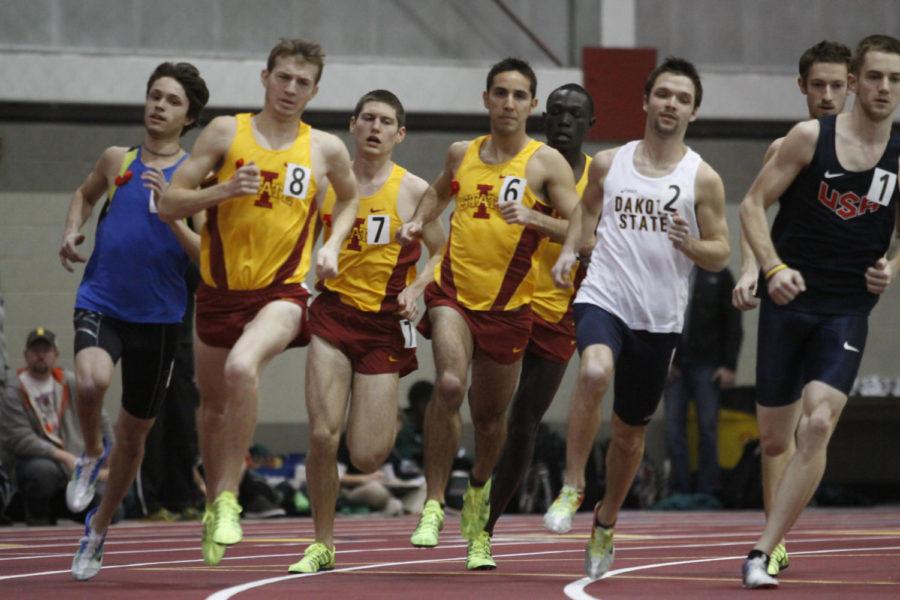 Alec Baldwin, left, Cullen Wannarka and Stephen Saylor come around the bend in the first heat of the mens one mile run at the ISU Open at Lied Recreational Center on Saturday. 
