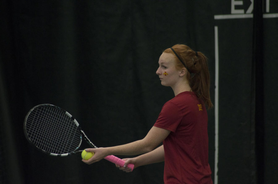 Senior Meghan Cassens serves the ball during the tennis match between Iowa State and Texas on March 27, which ended in a 4-2 loss for the Cyclones.