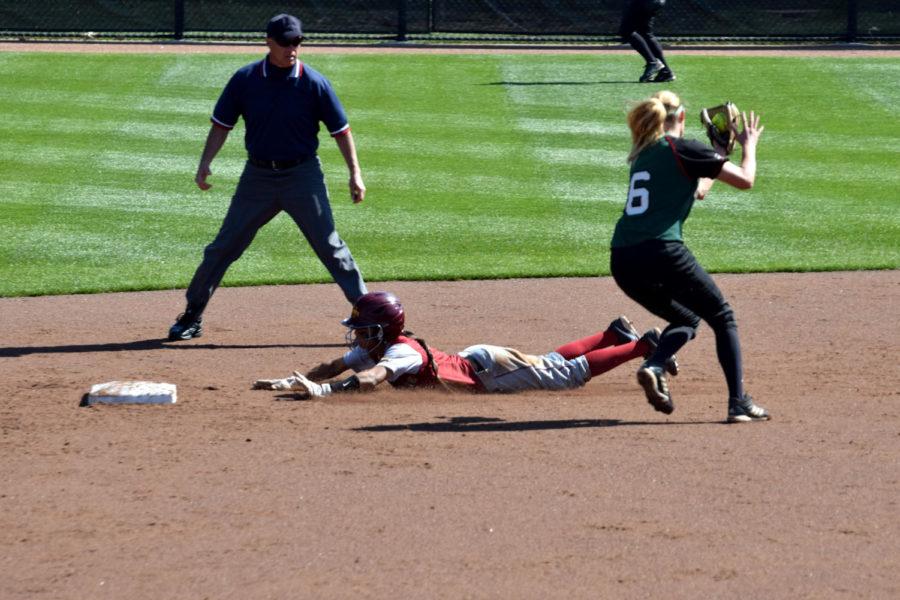 Junior Brittany Gomez slides safely into second base during a game against Green Bay on April 29 at the Cyclone Sports Complex.