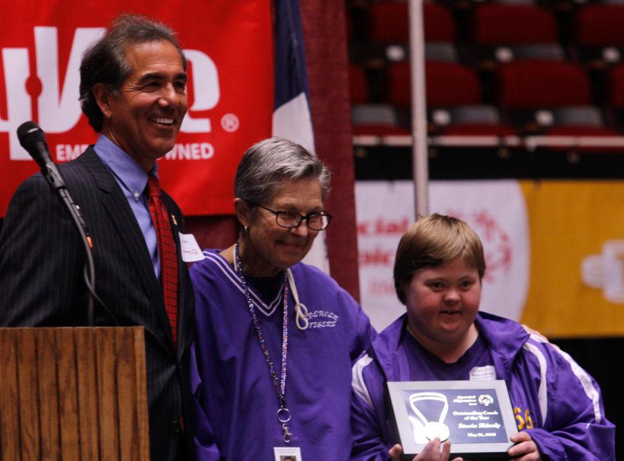 Stevie Shively (middle) received the Outstanding Coach of the Year award at the Special Olympics Iowa summer games Opening Ceremonies on Thursday, May 21 at Hilton Coliseum.