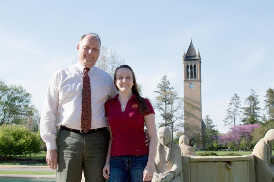 Emily and Steve Simpson pose for a photo on Central Campus. The two are graduating together, Steve with his Ph.D. and Emily with two bachelors degrees.