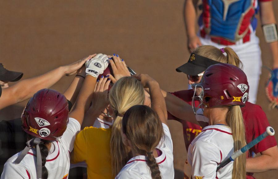 Junior+Aly+Cappaert+is+congratulated+by+her+teammates+after+the+first+of+two+solo+home+runs%C2%A0during+Iowa+States+11-4+loss+against+Kansas+on+Friday.