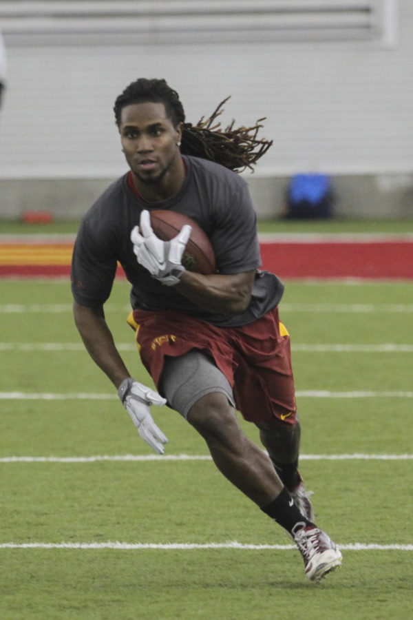 Jarvis West runs the ball at Pro Day on Tuesday, March 24. Twenty-seven NFL scouts came to watch ISU athletes.