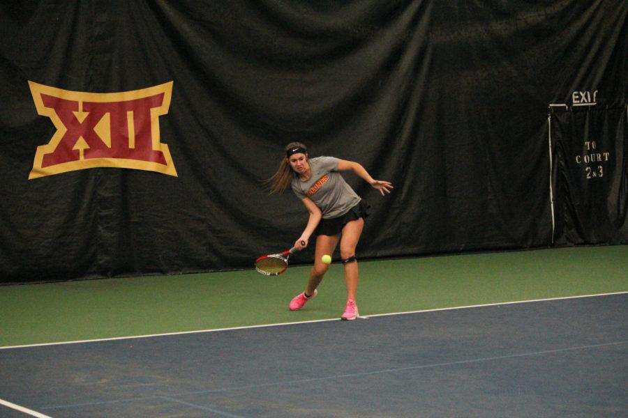 Sophomore Samantha Budai prepares to return the ball to her Oklahoma opponent on Feb. 22, 2015. The Cyclones lost 4-2.
