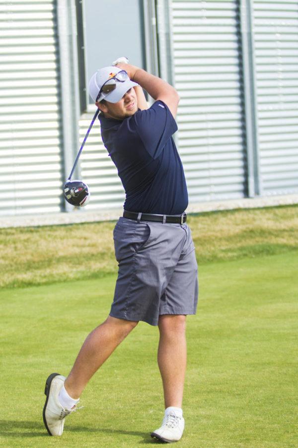 Senior golfer Sam Daley works on his swing at practice on April 14.
