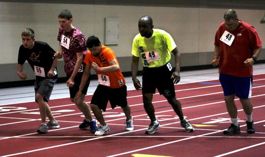Athletes compete in the 400-meter race at Lied Recreation Athletic Center on May 24, 2014.