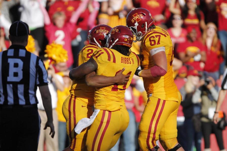 Freshman running back Martinez Syria celebrates with teammates after completing a 1-yard run for a touchdown in the third quarter giving Iowa State a 16-13 lead. Iowa State’s homecoming game against Toledo on Oct. 11, 2014 ended in a victory for the Cyclones, 37-30.