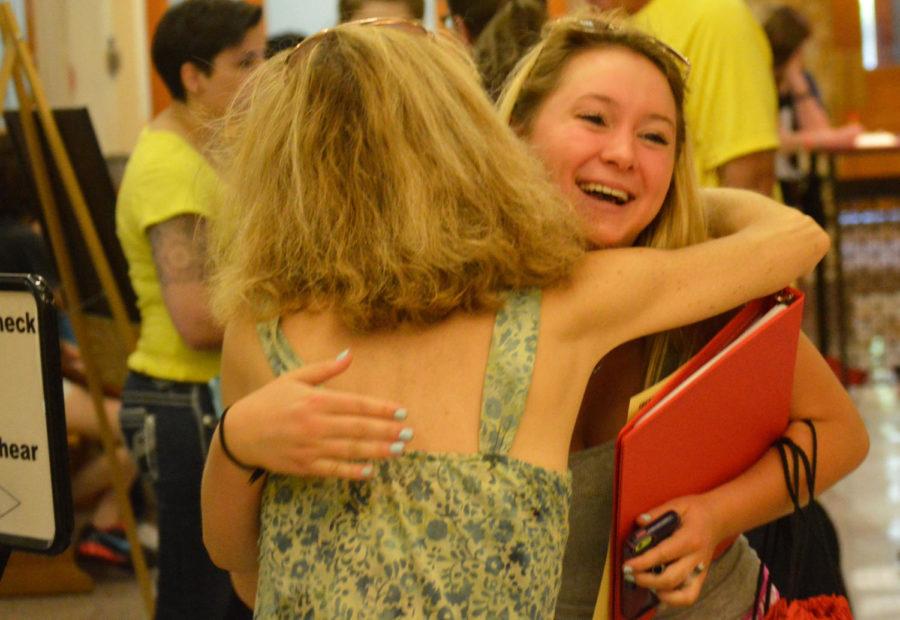An incoming freshman unexpectedly sees the mother of one of her hometown friends at Beardshear Hall on Tuesday during orientation.