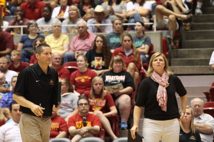 Assistant coach Jon Newman-Gonchar, left, and head coach Christy Johnson-Lynch look on as their players try to rally back and win a set against Florida State on Aug. 31. 