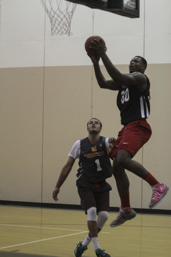 Deonte Burton goes up for a dunk at a Capital City League game on June 24. 