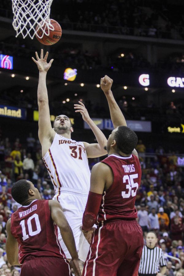 Junior forward Georges Niang puts up a shot during the Big 12 Championship semifinal game against Oklahoma on March 13 at the Sprint Center in Kansas City, Mo. The Cyclones defeated the Sooners 67-65 to advance to the final championship game against Kansas on March 14. Niang led the Cyclones with 13 points and eight rebounds.