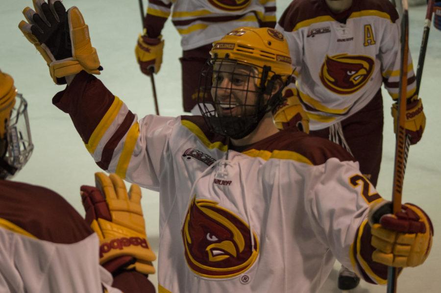 Freshman forward Joey DeLuca celebrates a goal with his teammates at the Cyclone hockey match against Midland University on Feb. 28, 2014. 