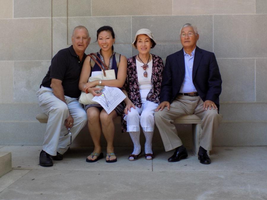 Steve Wagenheim, left, Rose Park, Catherine Park and Hong Sik Park sitting in the courtyard of the Food Sciences Building at Iowa State.