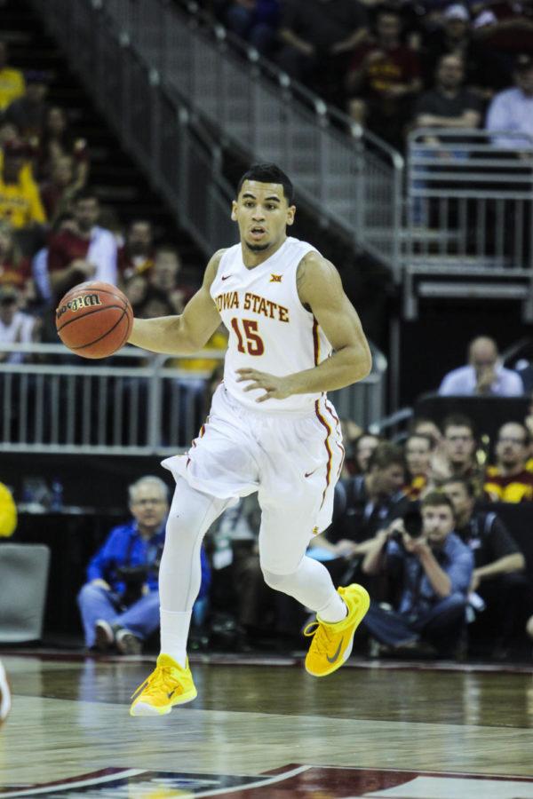 Naz Long runs the ball down the court against Texas in the Big 12 Championship quarterfinal on March 12, 2015 at the Sprint Center in Kansas City, Mo. 