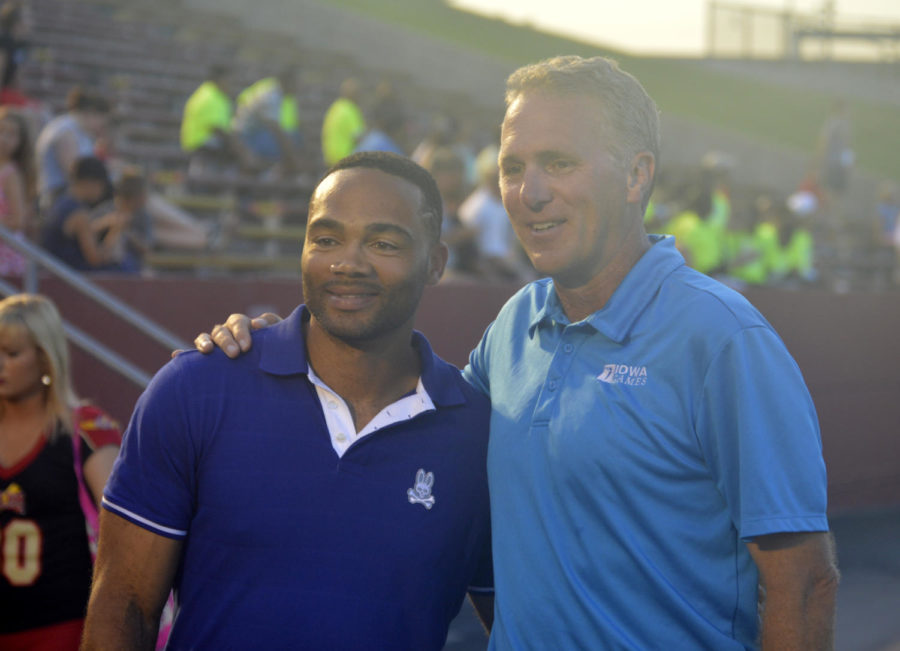 Former ISU quarterback Seneca Wallace poses for a photo with former Iowa quarterback Chuck Long at the Iowa Games opening ceremonies at Jack Trice Stadium on July 17, 2015. 