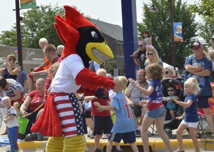Cy gets swarmed! Children surround Cy at the Ames Fourth of July Parade on Saturday.