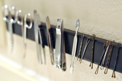 One easy way to save space and make your essentials easier to access: secure a magnetic strip somewhere in your bathroom. You can attach your favorite metal pieces, as well as keep your bobby pins in line. 