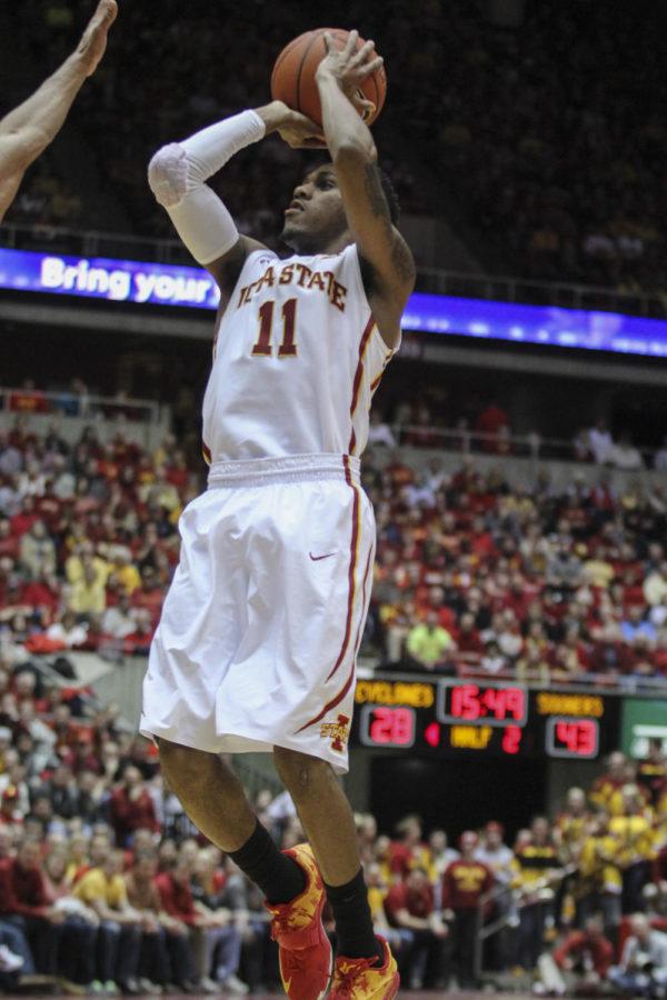 Sophomore guard Monté Morris attempts a jumper during the game against No. 15 Oklahoma at Hilton Coliseum on March 2. The No. 17 Cyclones defeated the Sooners 77-70 after a rocky 18-point first half. Morris had 19 points and five assists for Iowa State.