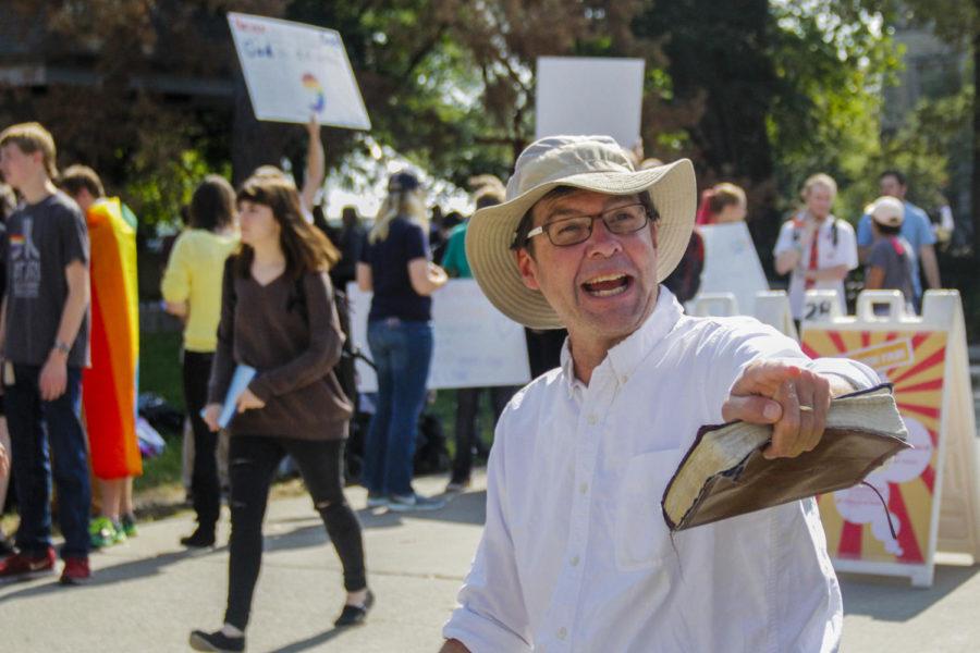 Pastor Tom Short, a traveling campus evangelist, set up in the free-speech zone in front of Parks Library on Sept. 25. Short goes to campuses to talk to students about his beliefs that God is real, heaven is true and Jesus is the way to heaven. Short said his goal is to spark conversation.