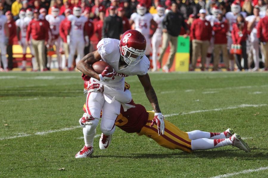 Redshirt+junior+defensive+back+Kenneth+Lynn+dives+for+the+Oklahoma+ball+carrier+Nov.+1%2C+2014.+The+Cyclones+fell+to+the+No.%C2%A019+Sooners+with+a+final+score+of+59-14.