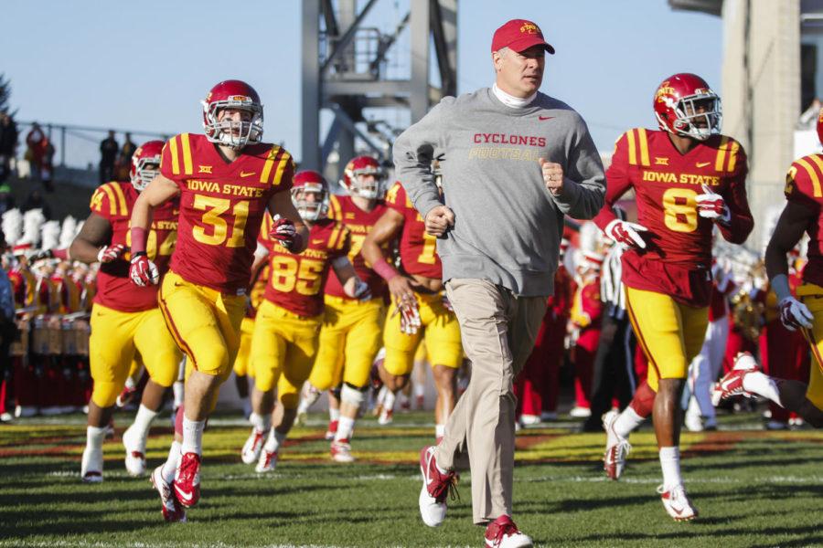 ISU coach Paul Rhoads leads the ISU football team out onto the field during the game against Texas Tech in 2014 at Jack Trice Stadium. The Cyclones fell to the Red Raiders 34-31.
