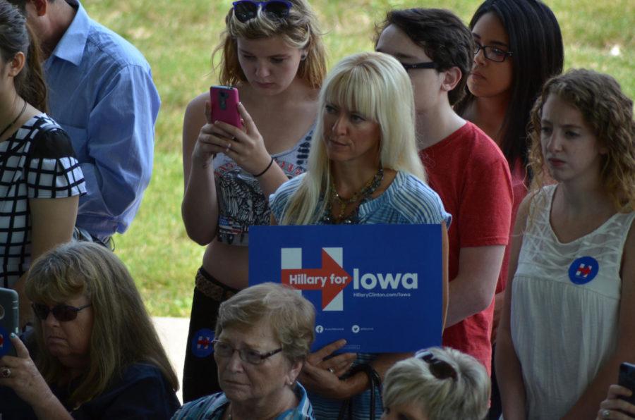 Audience members listen while Hillary Clinton speaks at John Deer Exhibition Hall in Ankeny, Iowa on Aug. 26. 