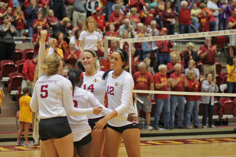 The team celebrates their victory over Dayton. They won 3 sets to 1.