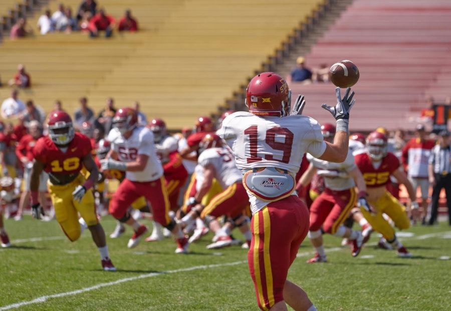 Redshirt sophomore wide receiver Trever Ryen turns to catch the ball before tearing down the field during Iowa States spring football game at Jack Trice Stadium on Saturday.