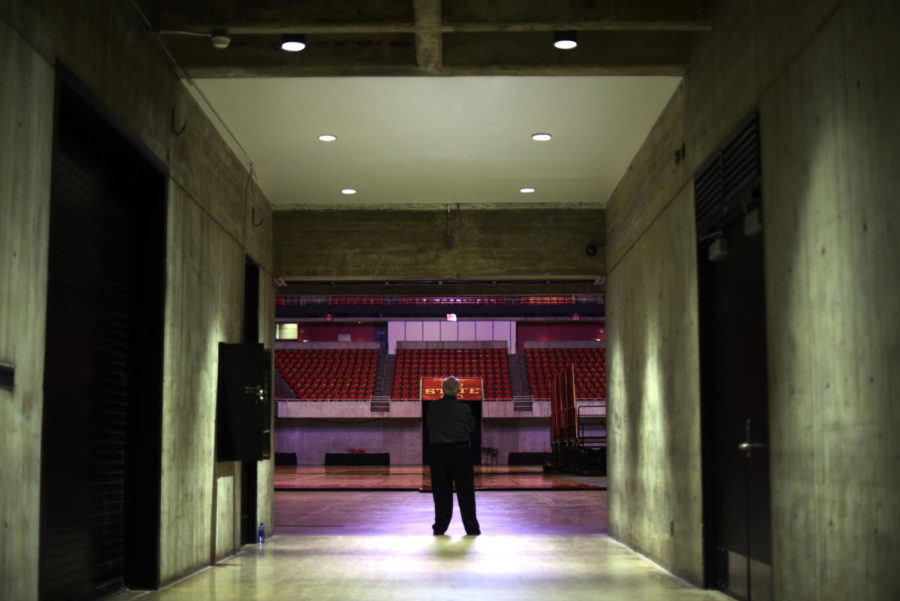 Usher Mark Moore stands in the tunnel before a performance by hypnotist Michael C. Anthony on Saturday Aug. 22 at Hilton Coliseum. The show concluded Destination Iowa State activities for the incoming freshman class.