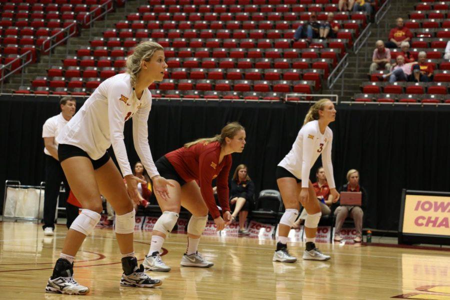 Redshirt junior outside hitter Morgan Kuhrt (right), senior libero Caitlin Nolan (center) and junior outside hitter Ciara Capezio (left) get set for the serve during the Cardinal and Gold scrimmage match on Aug. 22. These three will be the leaders for the team this upcoming season. 