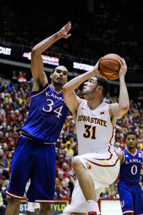 Kansas Perry Ellis attempts to block junior forward Georges Niang during Iowa States game against Kansas on Jan. 17. The Cyclones defeated the Jayhawks 86-81. Niang had 15 points in the game.