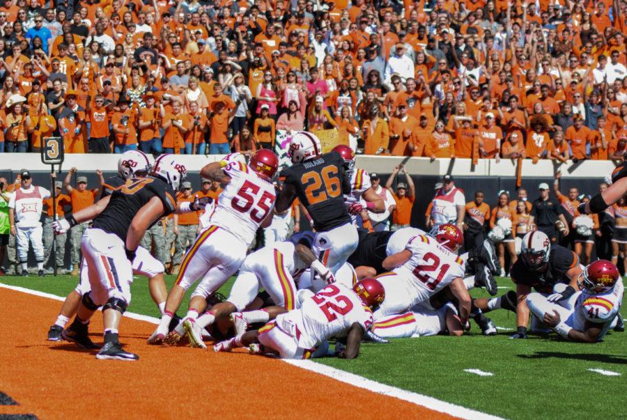 Former+ISU+linebacker+Jevohn+Miller+attempts+to+stop+OSU+ball+carrier+Desmond+Roland+at+the+goal+line+at+the+end+of+the+first+half+on+Oct.+4+in+Stillwater%2C+Okla.+Roland+was+ruled+short+of+the+goal+line+on+the+field%2C+but+replay+officials+controversially+overturned+the+call+and+said+it+was+a+touchdown.+The+Cyclones+fell+to+the+Cowboys%2C+37-20.%C2%A0