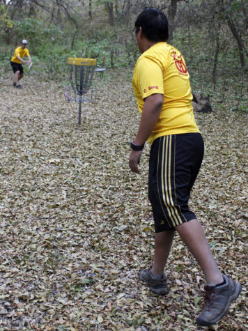 Sophomore Calvin Song, right, is the president of the Iowa State Disc Golf Club, in which members practice for recreational and competitive disc golf.