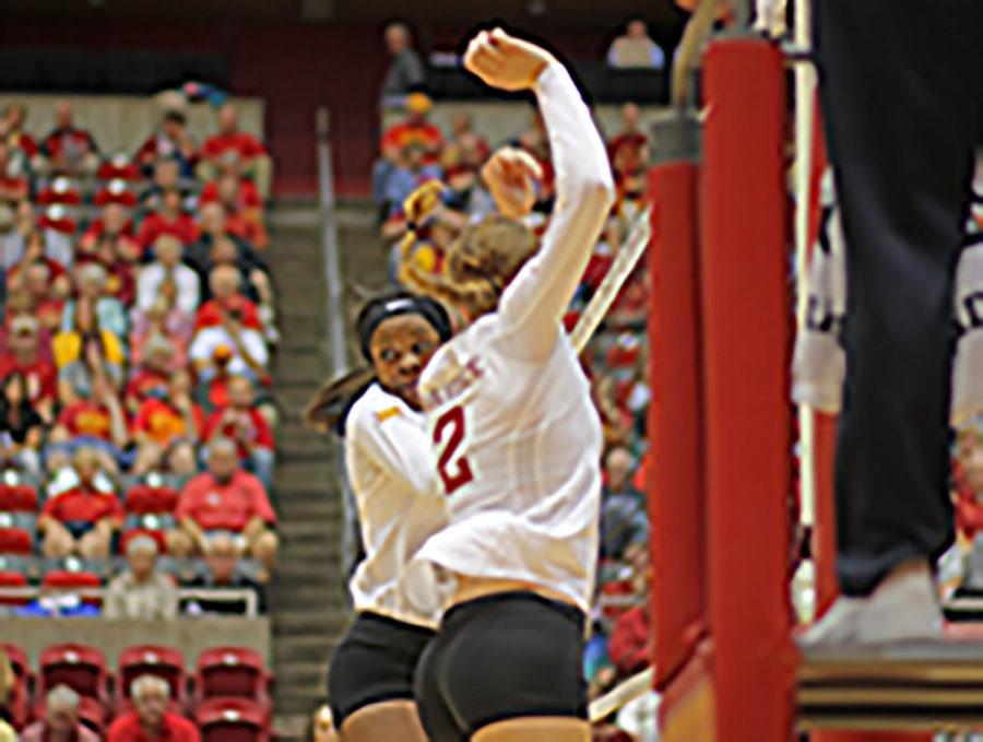 Senior Mackenzie Bigbee and freshman Grace Lazard in the air for a potential block. The Cyclones beat Dayton 3 sets to 1.