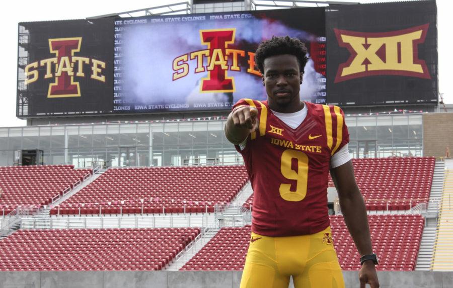 Wide receiver Quenton Bundrage poses at football media day in front of the new south end zone at Jack Trice Stadium on Thursday.