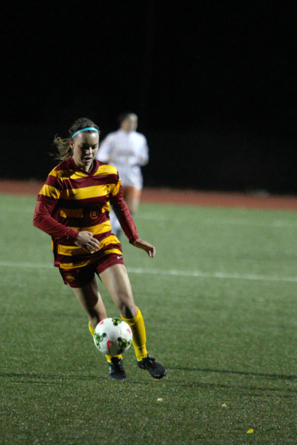 Madi Ott controls the ball at midfield during the soccer game against Texas on Oct. 3. The team improved from its 2-0 loss to Baylor from earlier in the week, but fell to Texas 1-0 during a cold and windy night at the Cyclone Sports Complex.