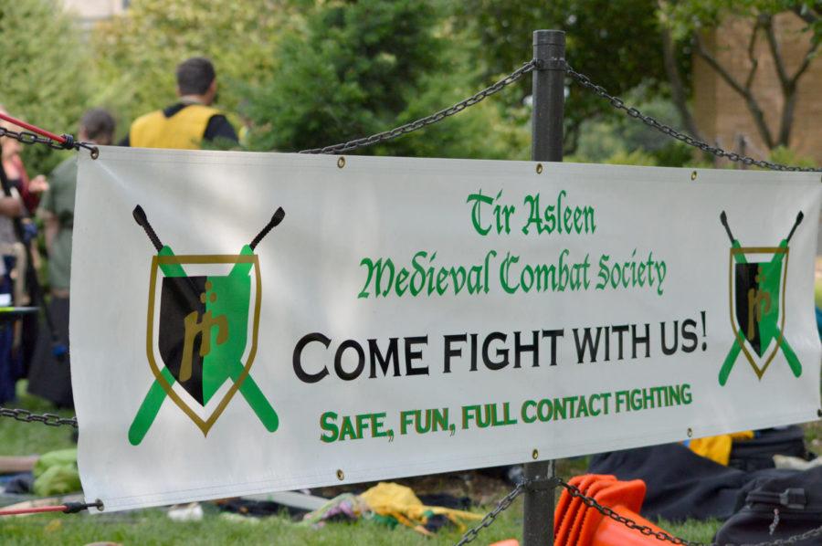 The Tir Asleen Medieval Combat Society welcomes new students with a banner on Central Campus on Aug. 22 during a combat simulation.