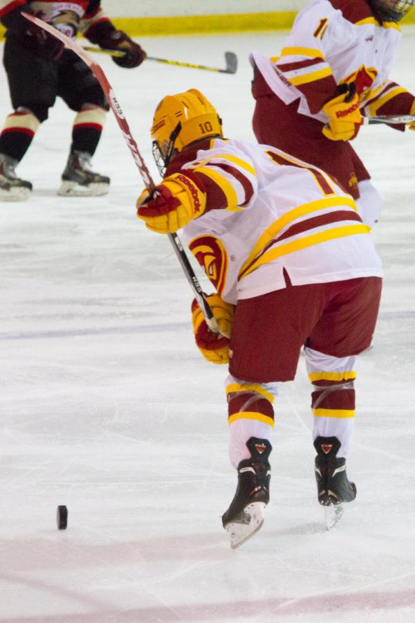 Sophomore Eero Helanto lines up a shot during the first period of a hockey game against the Southern Illinois-Edwardsville cougars. The cyclones would go on to win 11-1. 