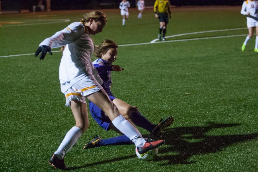 Sophomore forward Koree Willer is tackled by a TCU defender as she tries to cut toward the goal. Iowa State beat TCU 1-0 on Oct. 31 after scoring in the final minutes of the game.