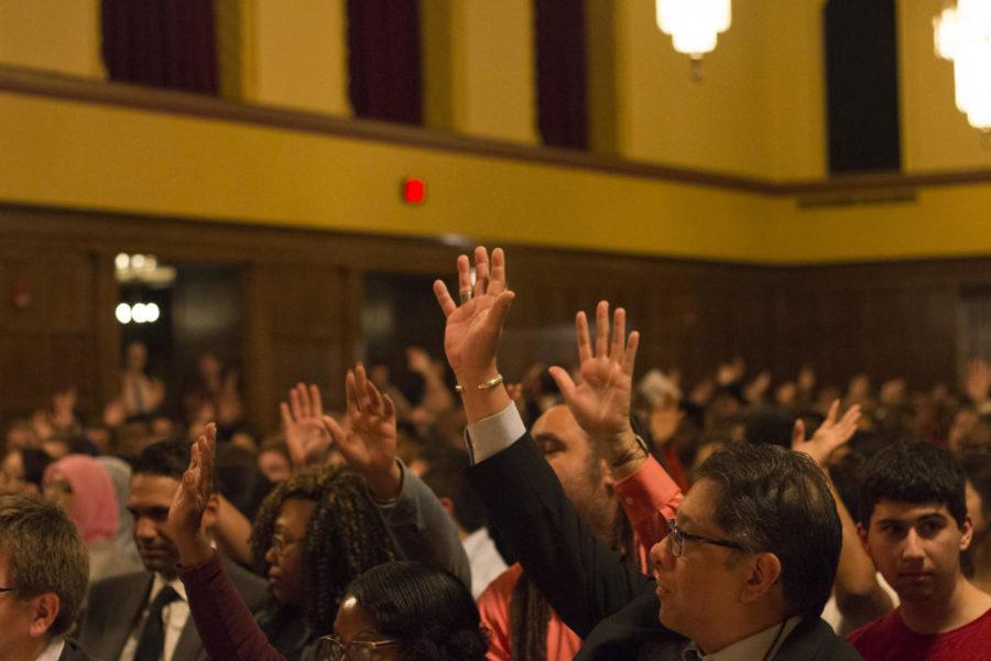 Audience members raise their hands in response to a question posed by the student panelists regarding the knowledge of a black community center on campus at the Students Against Bigotry discussion Wed. evening. The event was created to discuss Iowa State's plan to ensure the safety and inclusion of minorities on campus, as well as the events regarding the peaceful protests Sept. 12th. 