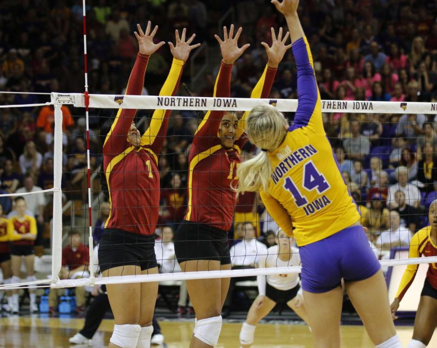 No. 1 sophomore setter Jenelle Hudson and No. 17 senior middle blocker Tenisha Matlock jump to block a spike during the game against Northern Iowa on Wednesday, Sept. 4, in Cedar Falls. The Cyclones defeated the Panthers 3-2 and now have an undefeated record of 4-0.  