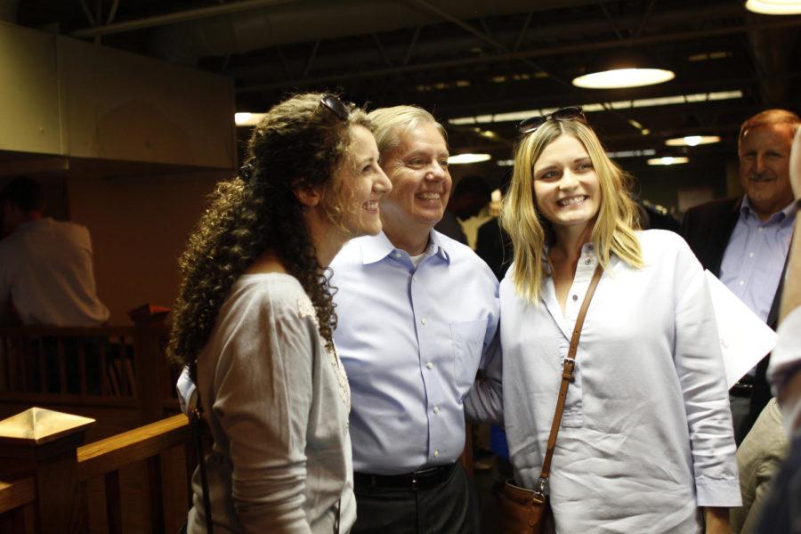 Lindsey Graham poses for photos with Iowa State students at his town hall meeting in Ames at Old Main located on Main Street. He talked for a short time and then answerd questions for the remainder of the time on Saturday, September 19.