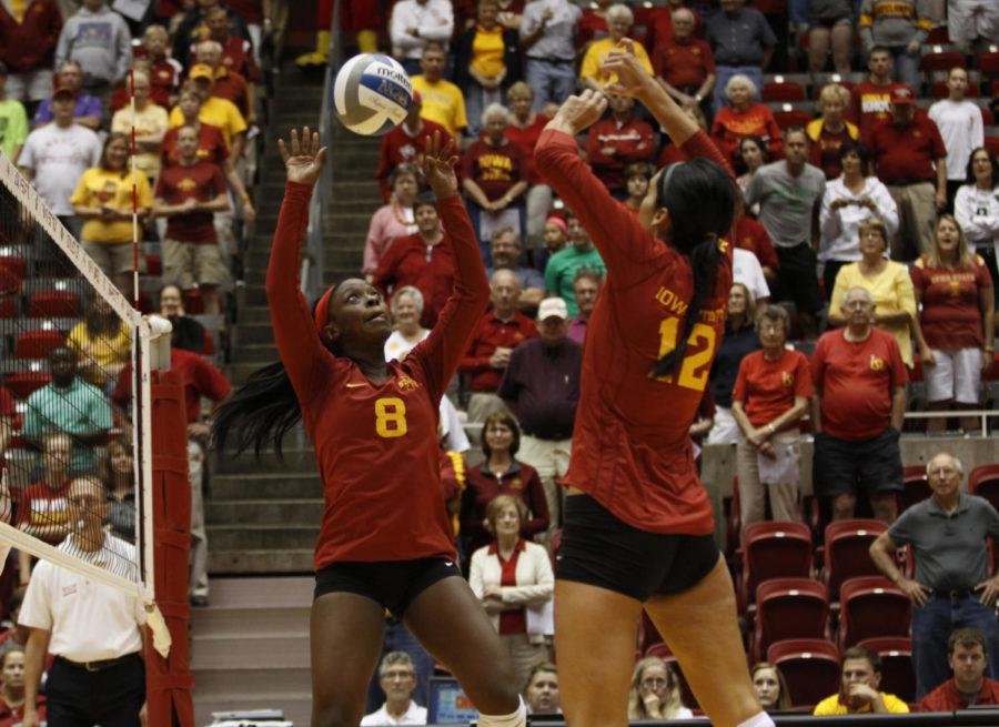 Sophomore Monique Harris (8) sets the ball for redshirt senior Tory Knuth (12) during their match against North Dakota on Wednesday, Aug. 29 at Hilton Coliseum. The Cyclones defeated the Fighting Sioux, 3-1.