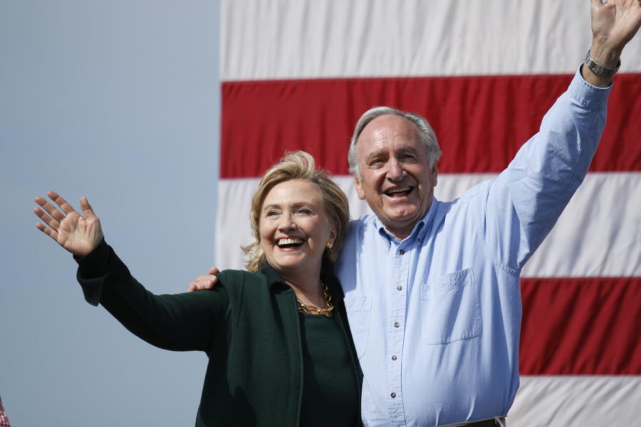 The Clintons make their entrance with Sen. Tom Harkin at the 37th annual Harkin Steak Fry in Indianola, Iowa on Sept. 14. Harkin has endorsed Clinton during her campaign in 2016.