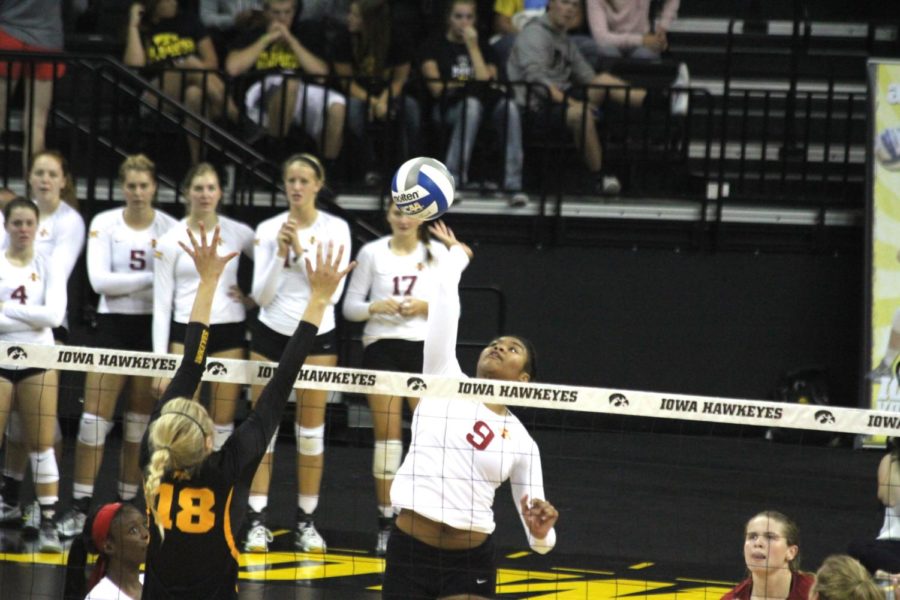 Redshirt sophomore middle blocker Samara West reaches for the kill during the Cy-Hawk matchup. West had six kills and a .500 hitting percentage in the 25-17, 17-25, 18-25, 26-28 loss on Friday.