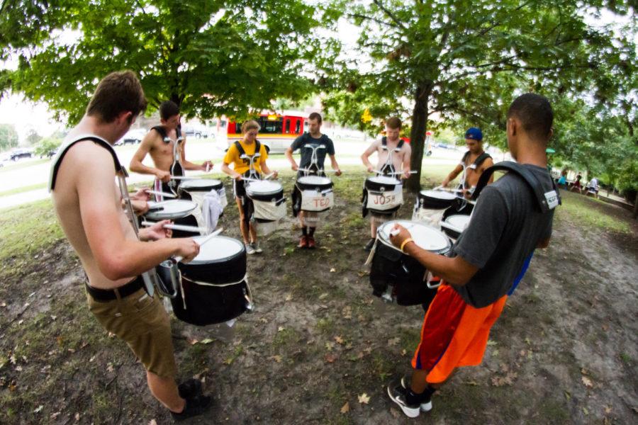 Members of the percussion section of the marching band practice outside the Town Engineering building during the afternoon of Sep. 22. 